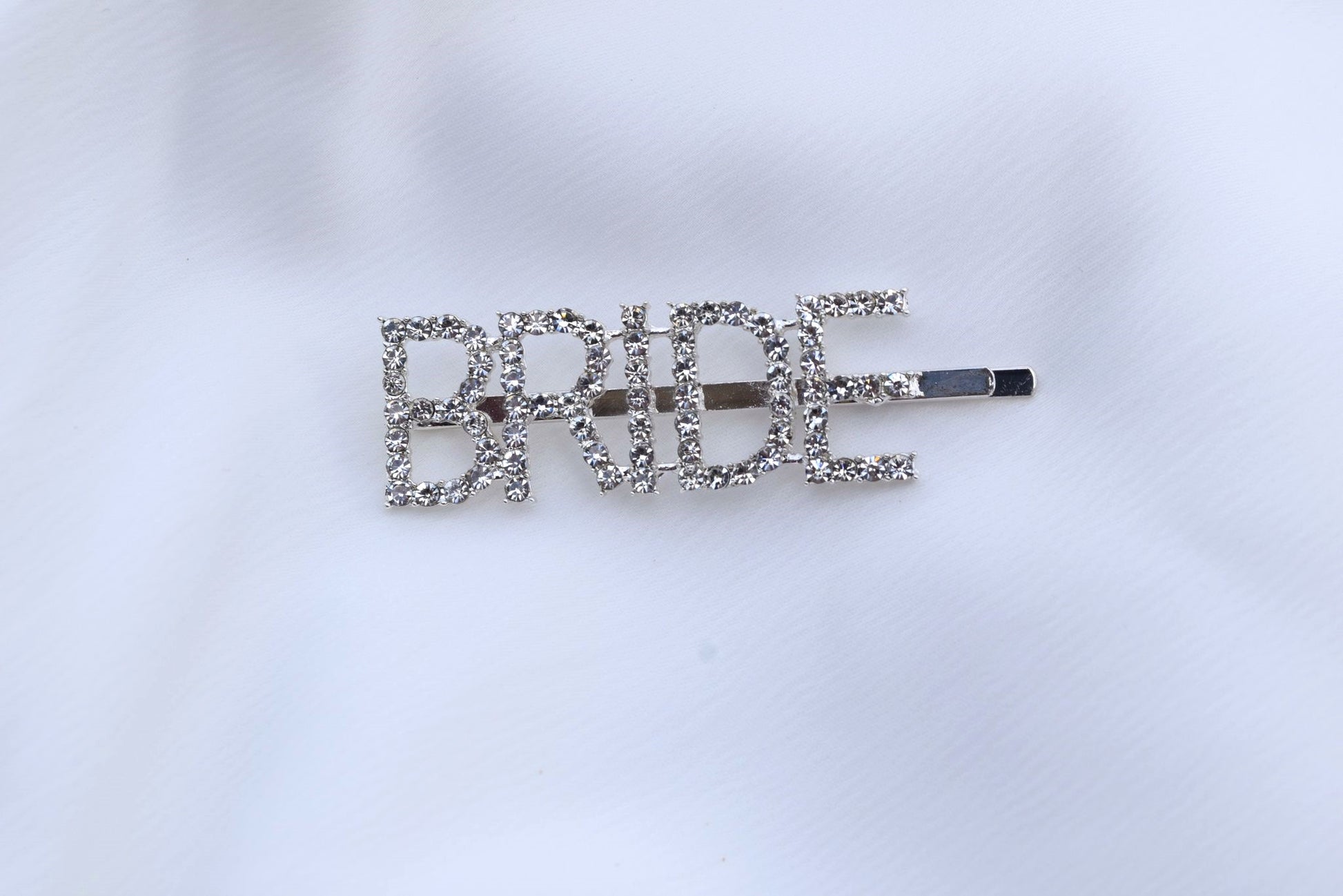 Close up of bride hair slide on white background